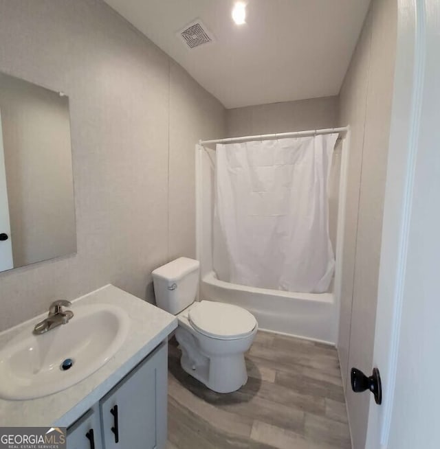 full bathroom featuring shower / bath combination with curtain, vanity, toilet, and wood-type flooring