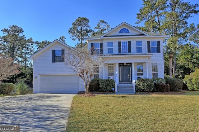 view of front of home featuring a garage and a front yard