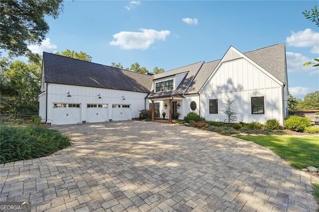 modern inspired farmhouse featuring a garage