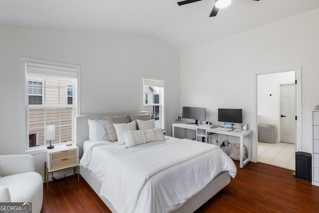 bedroom featuring ceiling fan, lofted ceiling, and dark hardwood / wood-style floors