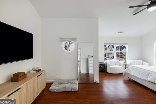 bedroom with dark wood-type flooring and ceiling fan