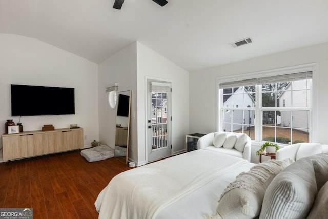 bedroom featuring ceiling fan, dark hardwood / wood-style flooring, and vaulted ceiling