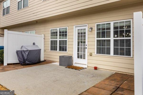 property entrance with a patio