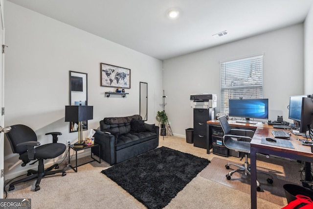 office space with carpet, visible vents, and baseboards