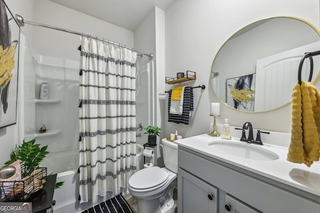 full bathroom featuring toilet, shower / tub combo with curtain, and vanity