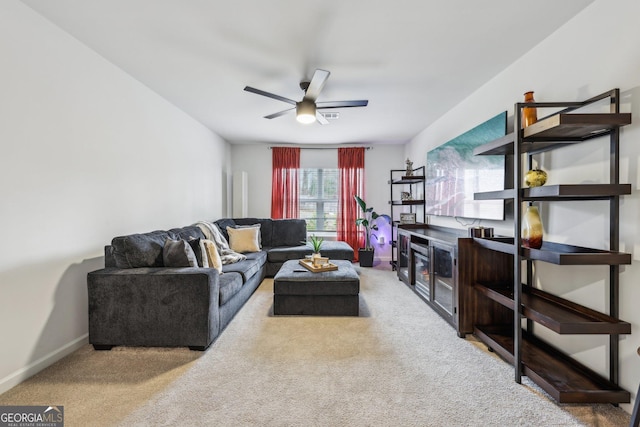 living room with carpet flooring and ceiling fan