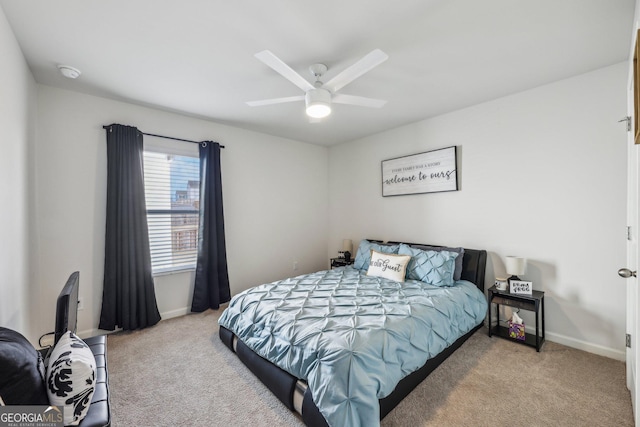 bedroom with light carpet and ceiling fan