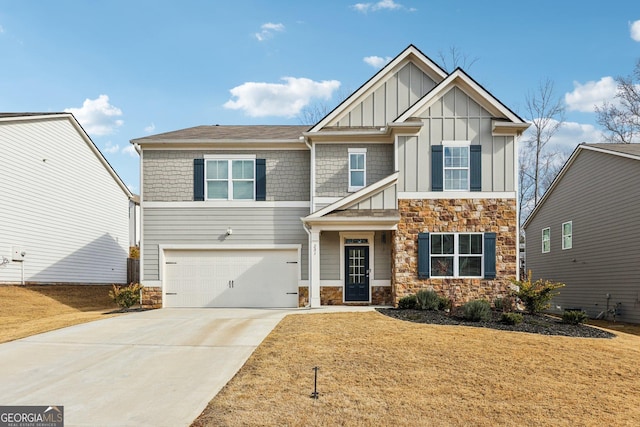 craftsman-style home featuring a garage and a front lawn