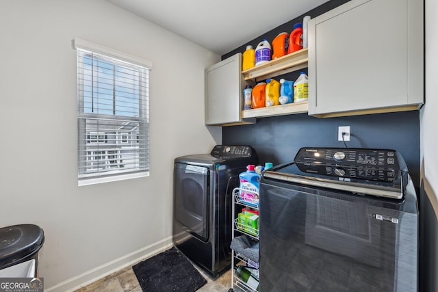 laundry area featuring cabinets and washer and dryer