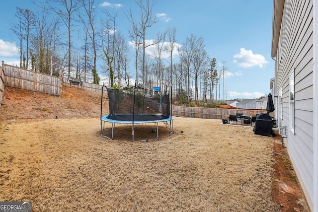 view of yard featuring a trampoline