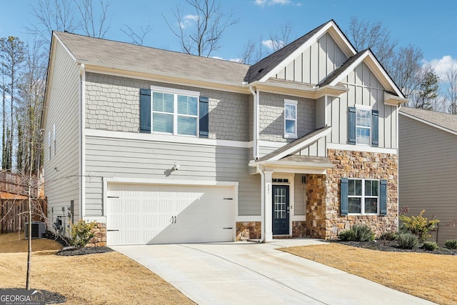 view of front of home with cooling unit and a garage