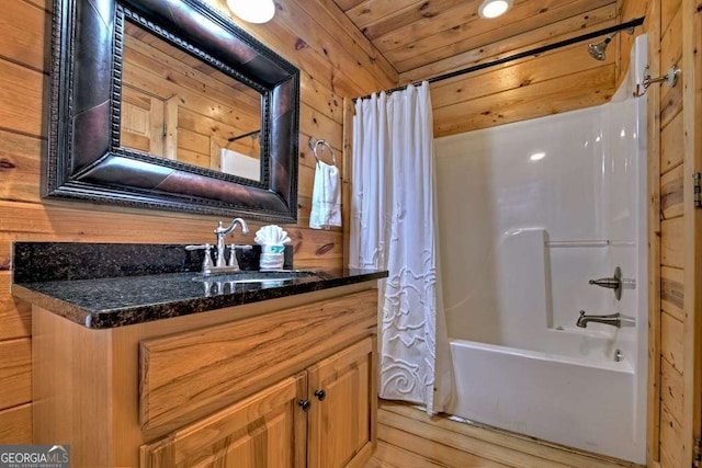 bathroom featuring vanity, wood ceiling, shower / bath combo with shower curtain, and wood walls