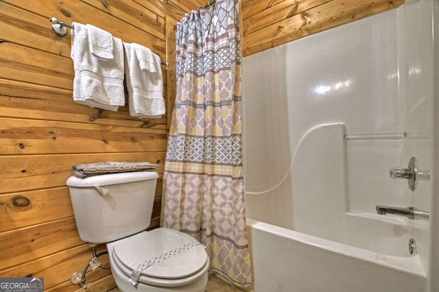 bathroom with shower / tub combo with curtain, toilet, and wood walls