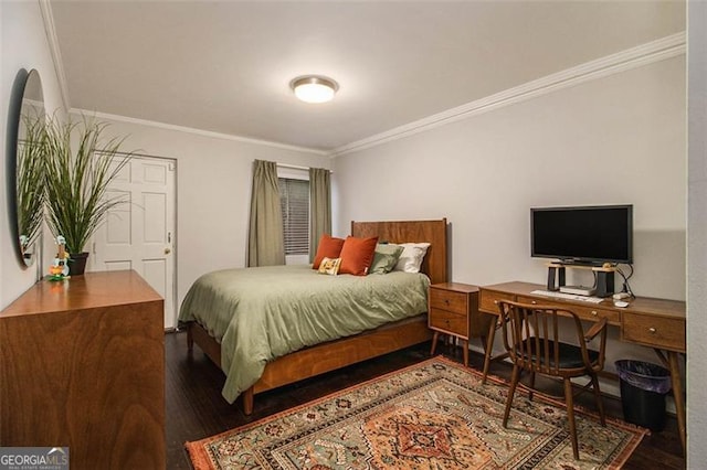 bedroom with crown molding and dark hardwood / wood-style floors