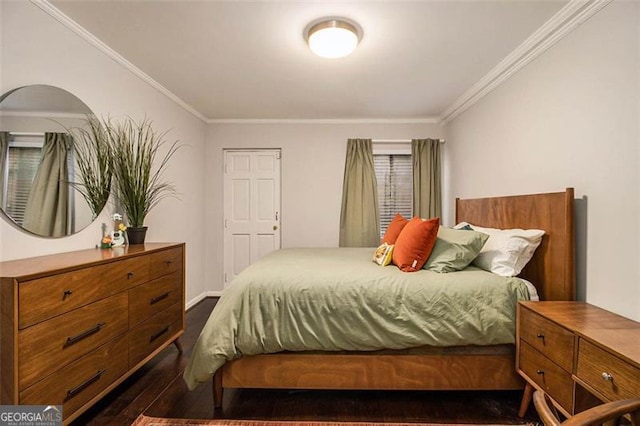 bedroom featuring ornamental molding and dark hardwood / wood-style flooring