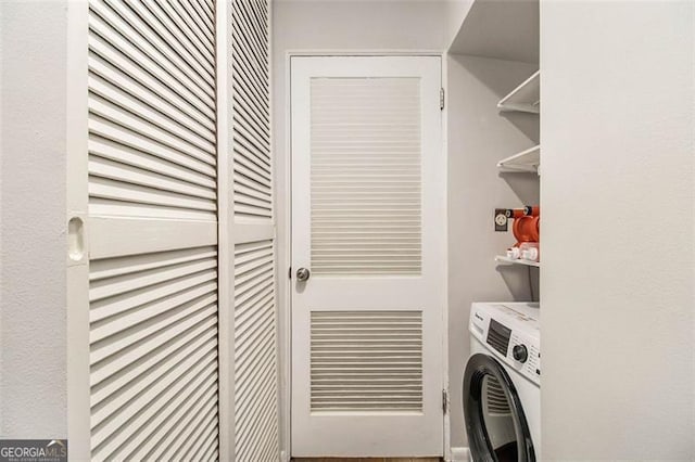 laundry area with washer / dryer