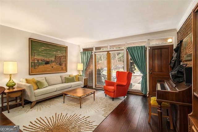 living room with hardwood / wood-style floors and ornamental molding