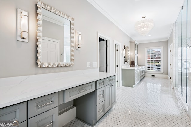 bathroom with an inviting chandelier, vanity, and crown molding