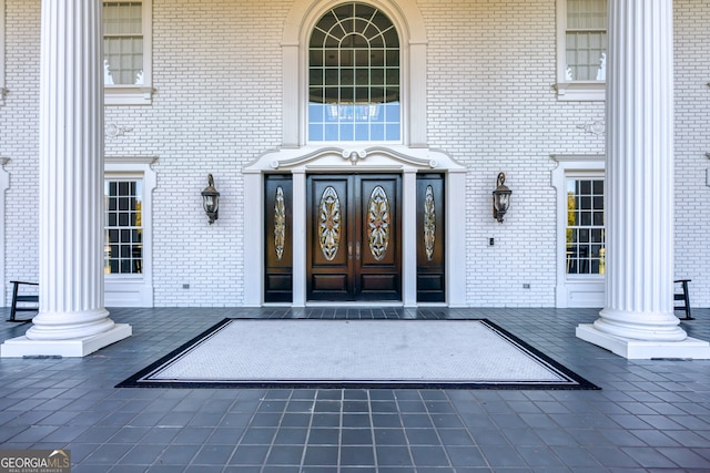 property entrance featuring covered porch