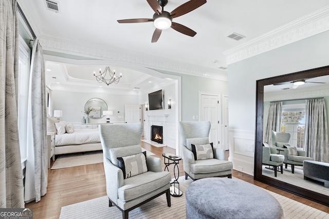 bedroom featuring ornamental molding, a chandelier, and hardwood / wood-style floors