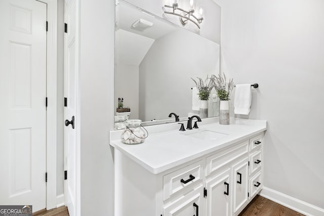 bathroom with vanity and wood-type flooring