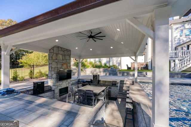 view of patio featuring a gazebo, an outdoor bar, and ceiling fan