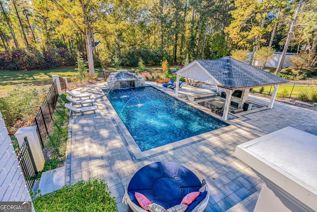 view of swimming pool featuring a gazebo, pool water feature, and a patio area