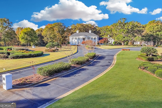 surrounding community featuring a lawn