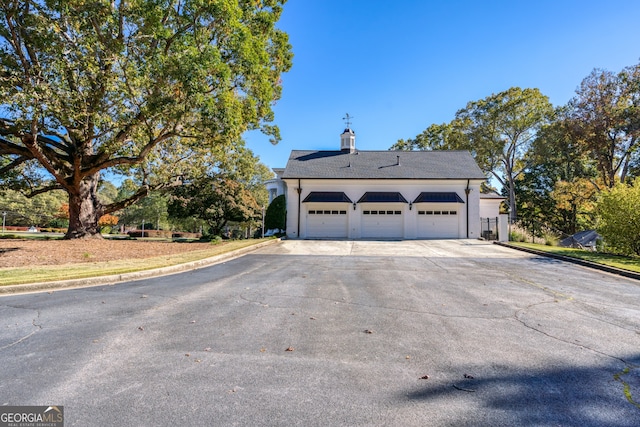 view of side of property featuring a garage