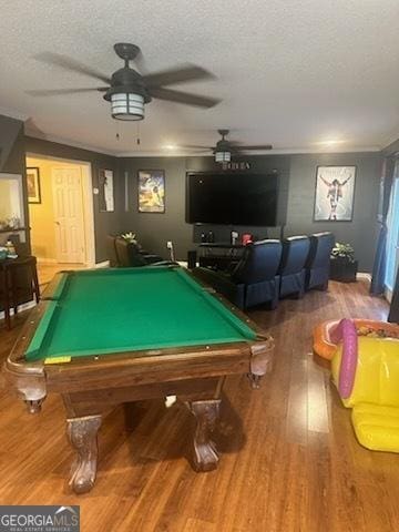 game room featuring hardwood / wood-style floors, billiards, a textured ceiling, and ceiling fan