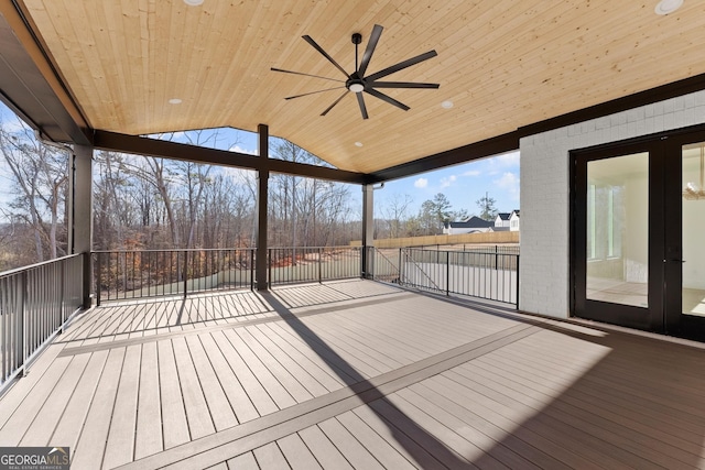 wooden deck featuring ceiling fan