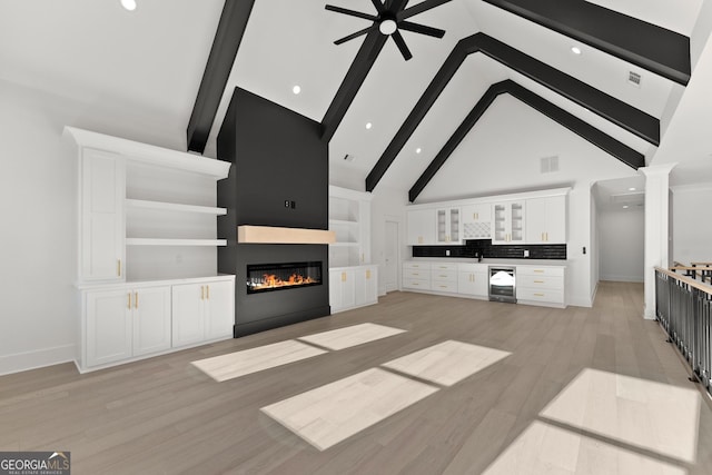 unfurnished living room featuring ceiling fan, beam ceiling, high vaulted ceiling, wine cooler, and light wood-type flooring