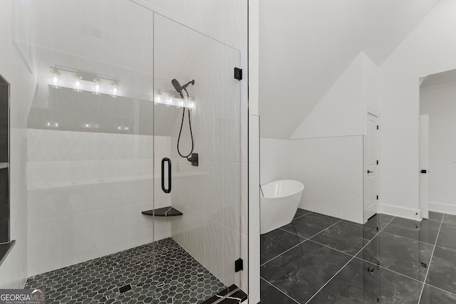 bathroom featuring shower with separate bathtub and vaulted ceiling