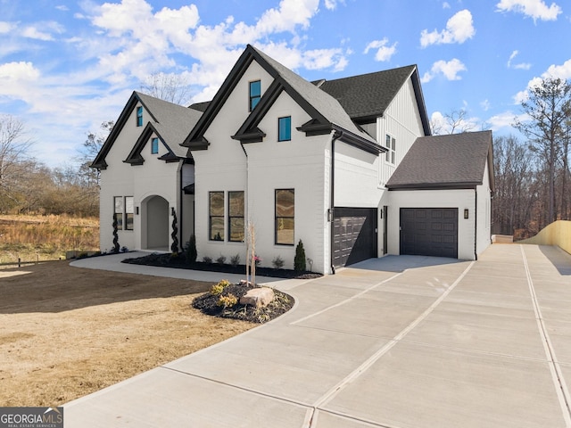 french country style house with a garage