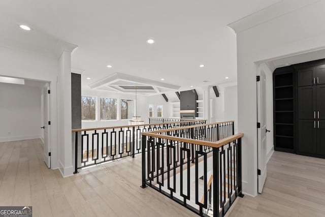 hall featuring ornamental molding and light wood-type flooring