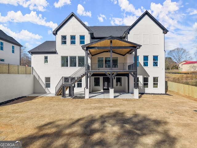 1041 Fleeman Rd, Hoschton, GA 30548 - rear view of property with stairs, a patio area, a fenced backyard, and a balcony