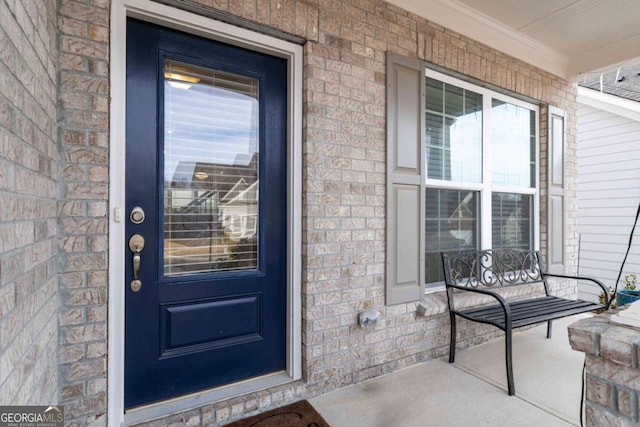 entrance to property featuring covered porch