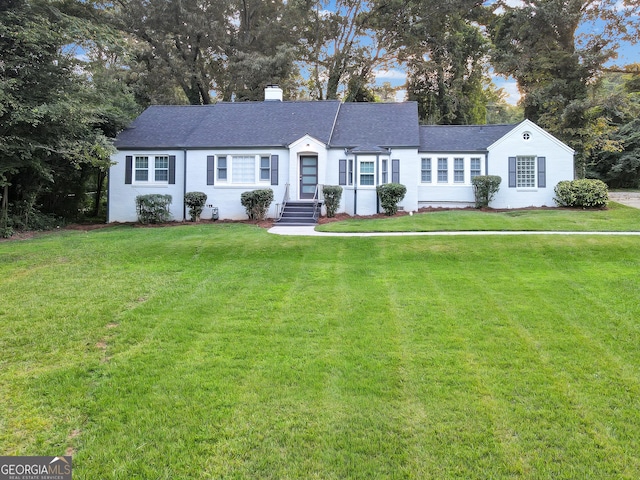 ranch-style house with a front yard