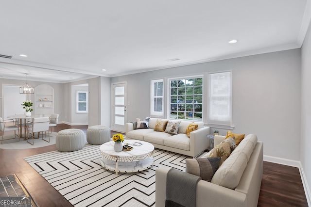 living room with hardwood / wood-style flooring and ornamental molding