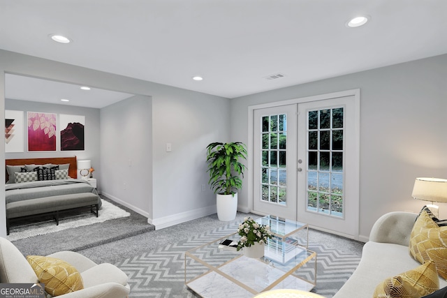 living room with french doors and light carpet