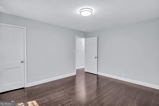 empty room featuring dark hardwood / wood-style floors