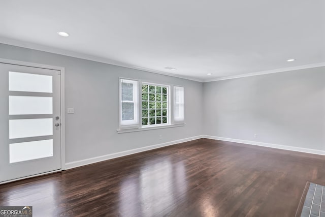 foyer featuring ornamental molding and dark wood-type flooring