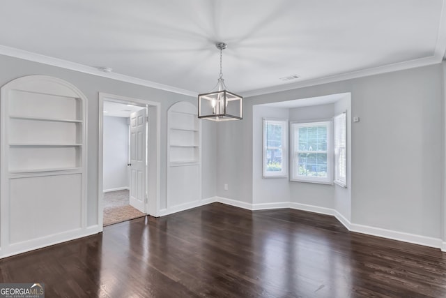 unfurnished dining area featuring crown molding, dark wood-type flooring, built in features, and a chandelier