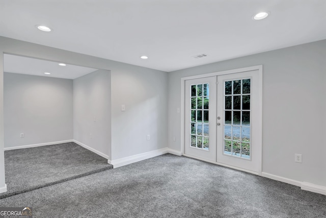 unfurnished room with carpet floors and french doors