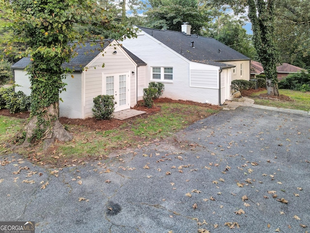 view of side of property with french doors