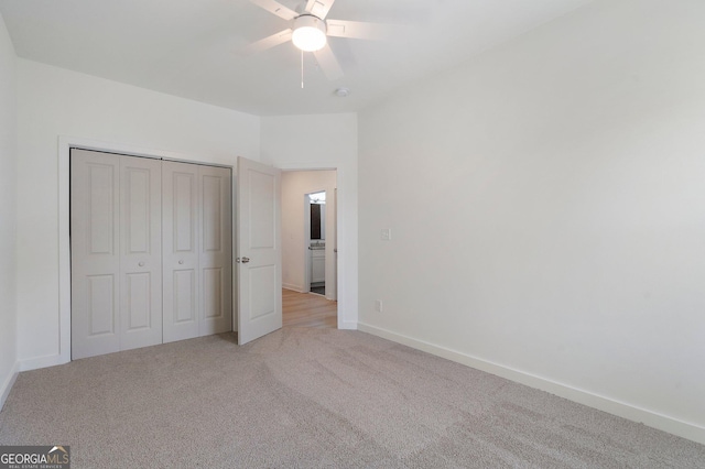 unfurnished bedroom with light carpet, ceiling fan, and a closet