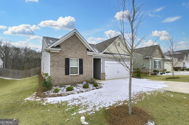 view of front of house with a garage and a lawn