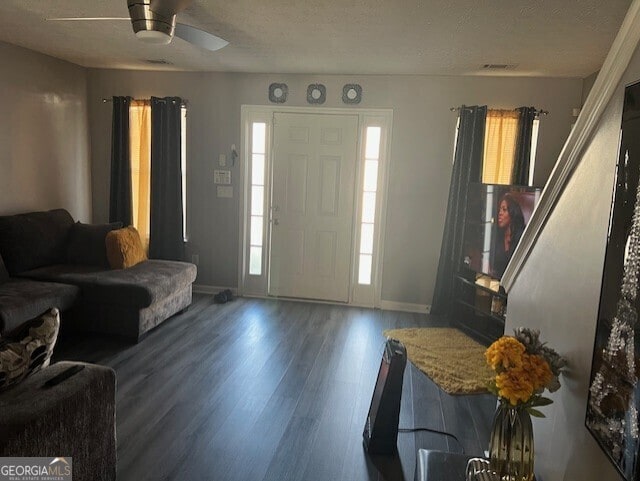 foyer featuring a textured ceiling, hardwood / wood-style floors, and ceiling fan