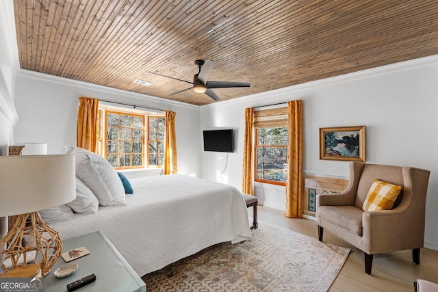 bedroom with crown molding, wooden ceiling, ceiling fan, and light hardwood / wood-style flooring