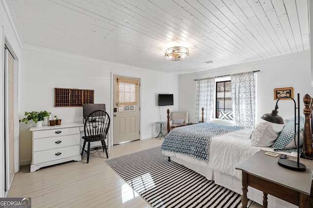 bedroom with wood ceiling, light hardwood / wood-style flooring, and ornamental molding